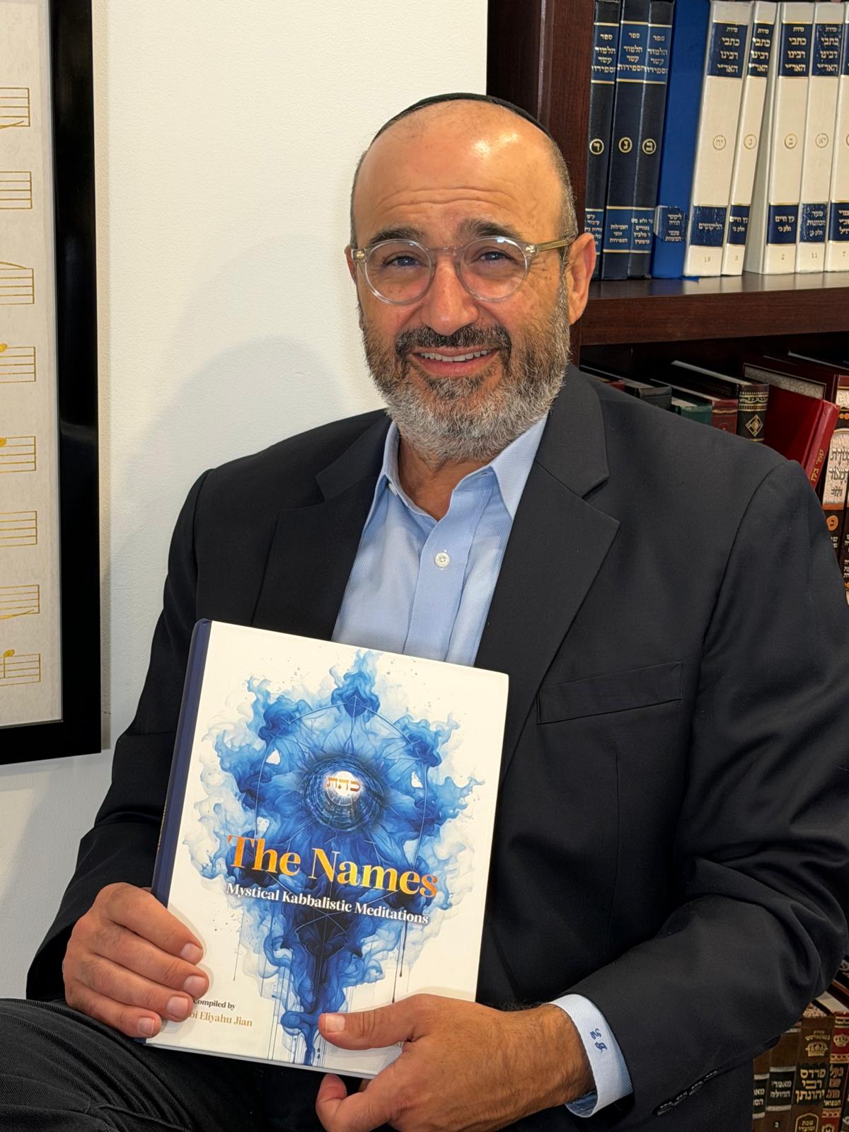 Rabbi Eliyahu Jian holding The Names book